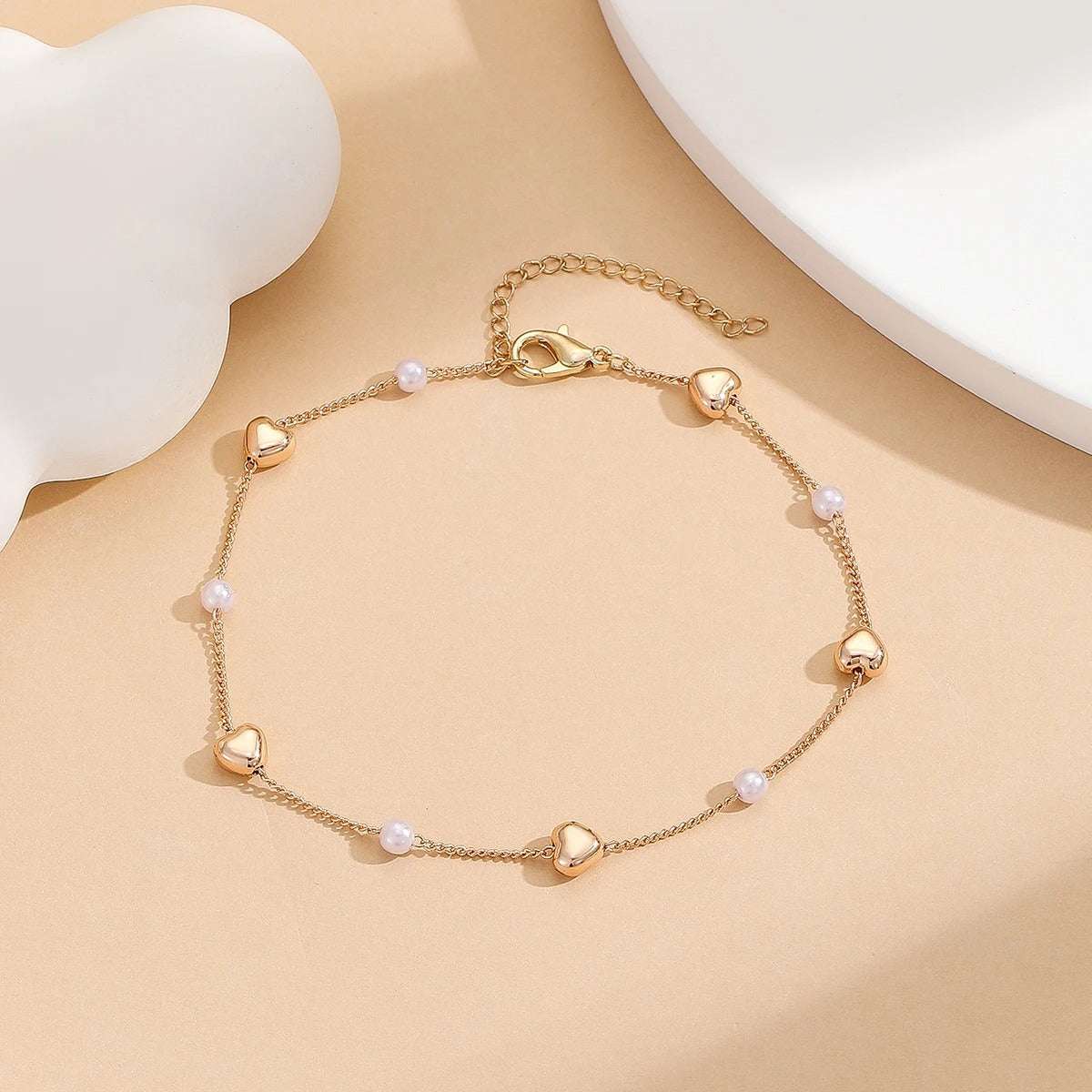 TORNOZELEIRA CORAÇÕES E PÉROLAS BANHADA EM OURO 18K - TOR18